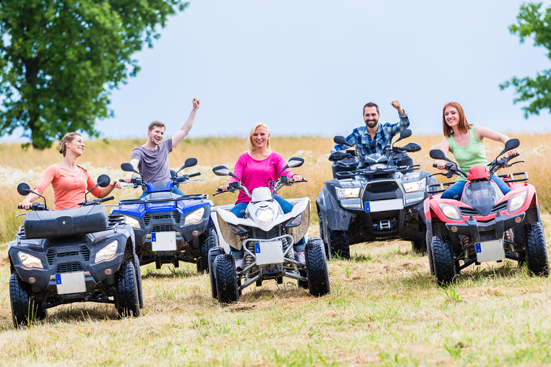Family riding 4 wheelers