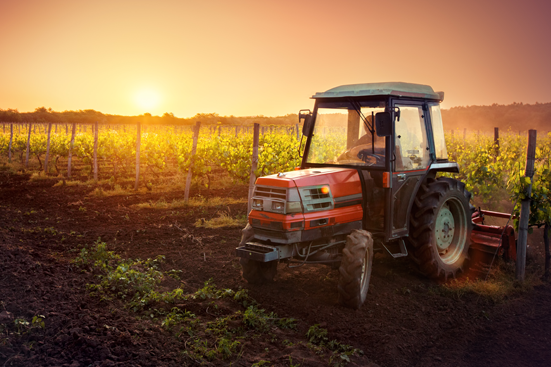 Farming tractor in field